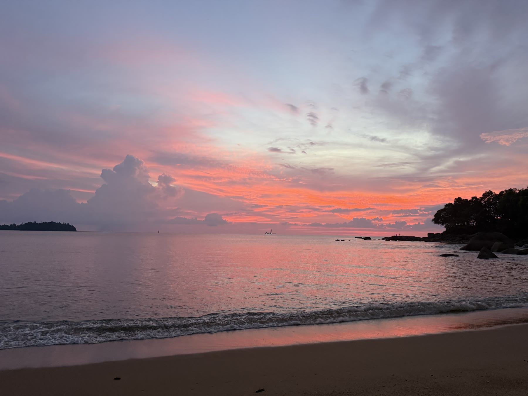 Pink sunset over a quiet beach in Thailand